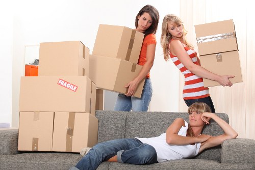 Local customer loading boxes into a storage unit at home